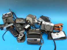 A collection of vintage cameras and equipment including a Keystone cine camera, Halina, Panasonic,