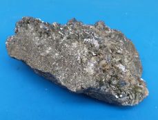 A geological sample formed of dark grey crystals,