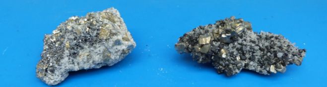 Two small geological samples formed of grey quartz,