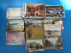 A large collection of postcards including humorous,