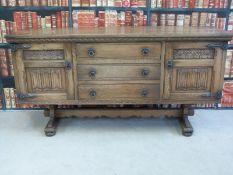 A carved oak Old Charm style sideboard (H163 x L46 x W83cm)