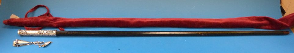 A ebonised white metal handled walking cane,