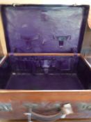 A leather case with fitted interior