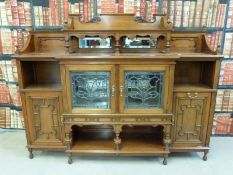 A late 19thC break front sideboard with over shelf and bevelled mirrors to top,