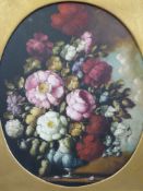 A pair of oils on canvas of flowers in oval mounts and gilt frames (50cm x 40cm)