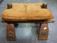 A Libyan leather camel stool