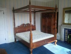 A French carved walnut four poster bed with all fittings (approx H248cm x W190cm)