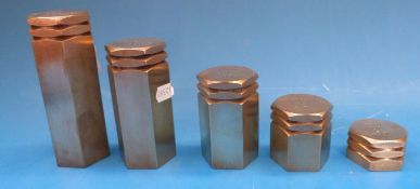 A run of five hexagonal brass troy weights,
