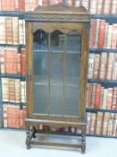 An oak glazed bookcase/ display cabinet (W57 x D29 x H131cm)