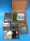 A collection of magic lantern slides to include set of colour slides of London,