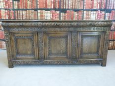 A large 19th/20thC carved oak sideboard with three convex drawers and cupboards under (L200 x D53 x