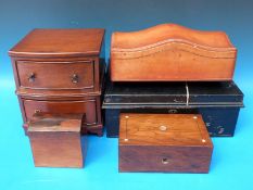 An apprentice bow fronted chest of two drawers together with a gilt leather shaped stationery box
