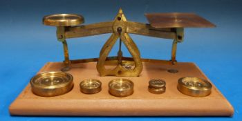 A set of possibly Setten & Durward postage scales on tooled leather base