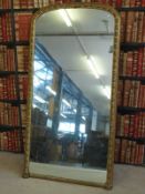 A large wall mirror in gilt wood frame,