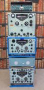 Three various Racal radio receivers together with other rack mounted equipment and a Heathkit