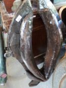 A rustic oak and leather horse harness