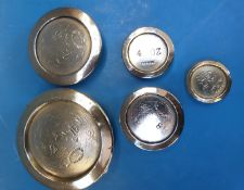 A run of flat stacking nickel weights comprising 2lb down to 2oz,