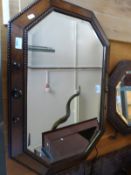 An oak framed bevelled glass mirror