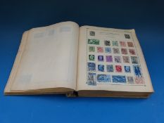 A collection of all world stamps in a Strand stamp album