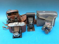 A quantity of cameras/binoculars to include Agfa Isolette,
