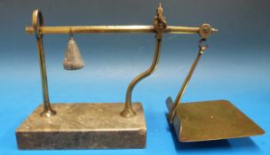 A set of Avery cantilever letter scales on grey marble base