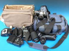 A collection of cameras and accessories to include Olympus OM10 SLR together with Super Paragon PMC