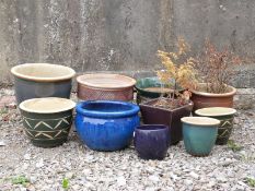 A collection of decorative pots and jardinieres