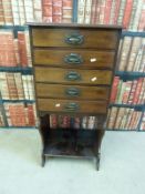 A mahogany Art Nouveau music cabinet of five drawers (W48 x D38 x H101cm)