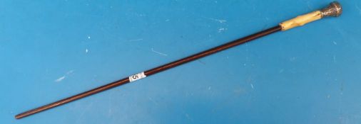 A conductor's baton with wooden shaft, ivory handle and silver knop (Ldn 1888),