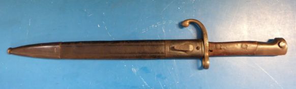 A possibly French late 19th century / WWI era bayonet in scabbard.