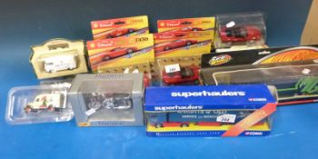A collection of boxed toy vehicles including Corgi, Superhauler,