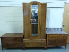 An oak single mirror front wardrobe with matching washstand and chest of drawers