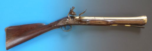 A Hughes of Corke blunderbuss the large brass barrel with ornate engraving, naming and IH,