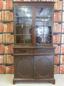 A late 19th/ early 20thC glazed mahogany bookcase with adjustable shelves to top,