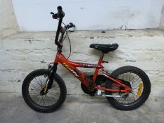 A red child's bicycle