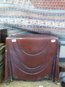 A red painted occasional table formed as a cloth over a table (59cm square,