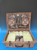 A retro 60s/70s picnic set in wicket basket