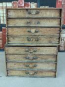 Two sets of four drawers, suitable for paints,
