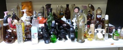 A large collection of Avon scent bottles including novelty examples