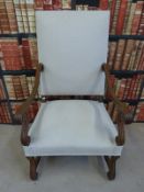 An upholstered oak chair in the Queen Anne style