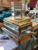 A collection of small collector's display cabinets