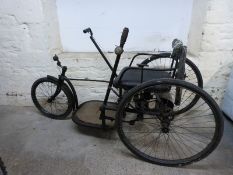 A c1914 hand-powered tricycle,