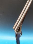 A Cogswell & Harrisson side by side shotgun.