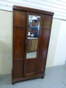 An oak wardrobe with mirrored doors (W91 x D44 x H185cm)