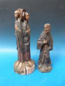 A carved and painted figure of a monk (height 31cm) possibly dated 1796 to underside,