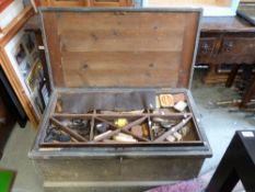 A large and extensive collection of woodworking tools including planes and other tools housed in a