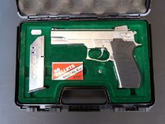 An ASGK Smith Wesson BB airsoft pistol in fitted hard carry case