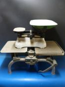 A set of W & T. Avery Ltd 28lb grocer's scales, together with a set of A.M. Griffin & Co.