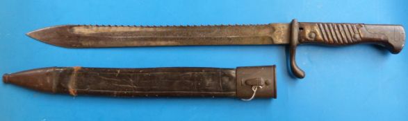 A WWI sheathed saw back bayonet