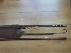 An early cane fishing rod with top crop housed inside the butt section,